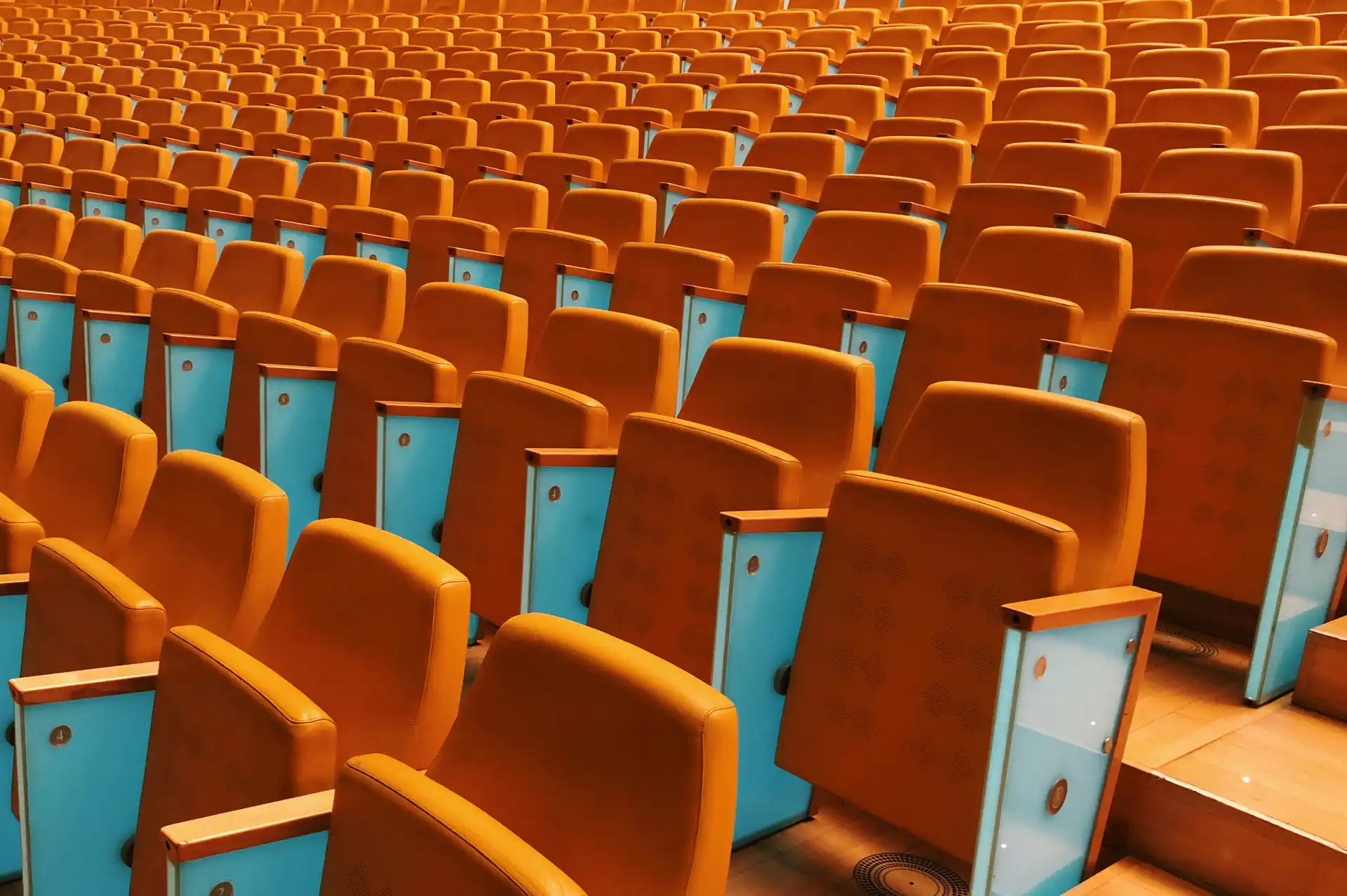 Tiered auditorium seating in a Marrakech congress venue, laid out for a plenary session