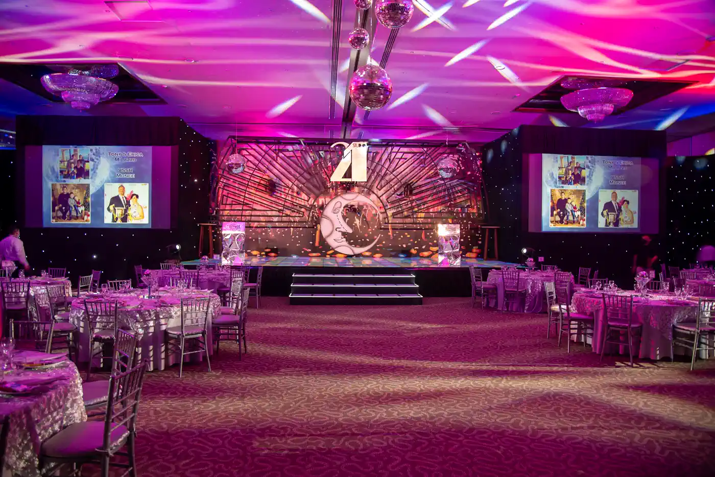 Conference room in Marrakech set theatre-style with uplighting and a branded screen for a corporate event